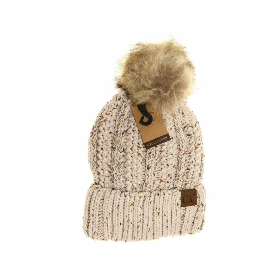 Knitted beanie with fur pom-pom and brand tag on a white background